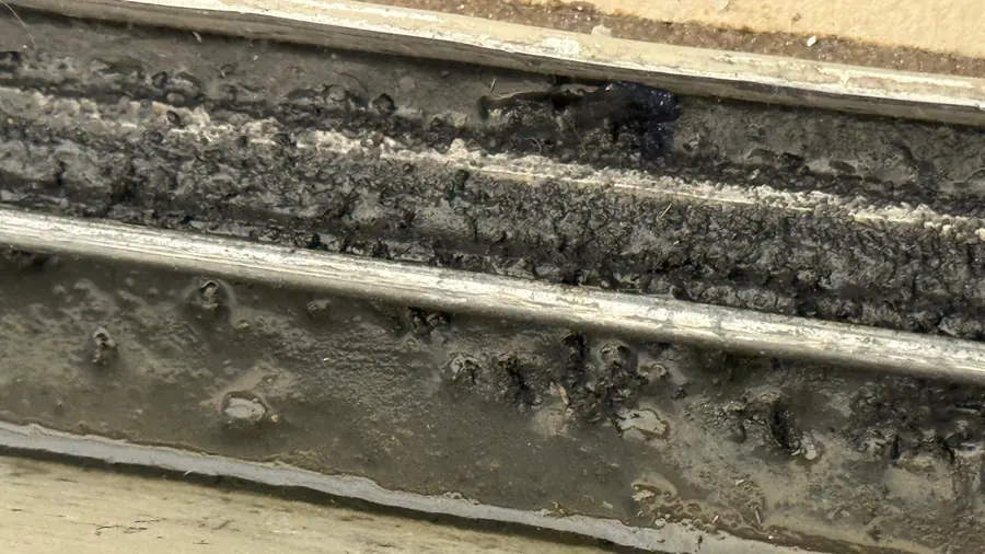 Sliding door track with heavy buildup after cleaning did not solve the problem